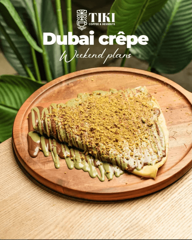 Folded crêpe oozing pistachio cream and chocolate, dusted with pistachio