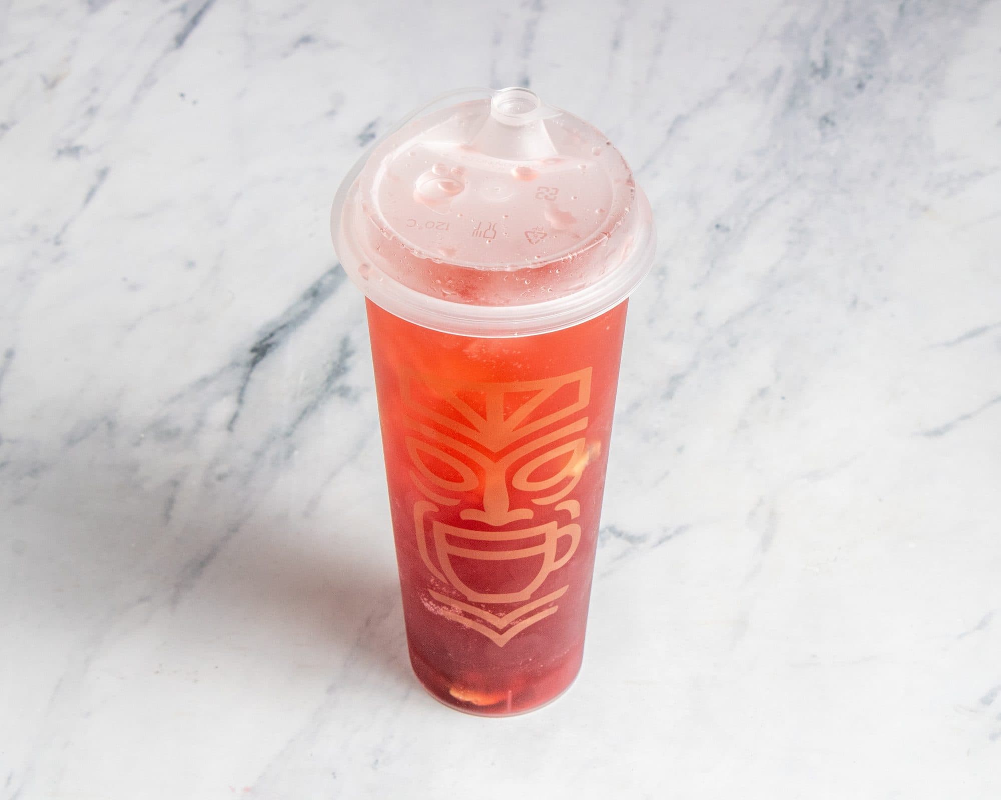 A dragon fruit and peach refresher over ice